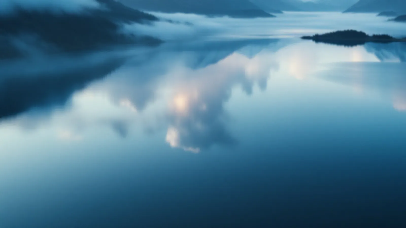 Two calm mountain lakes side by side reflecting silver clouds at dawn, the ChromeQuotes view of compare personal loan offers, $100 – $5,000
